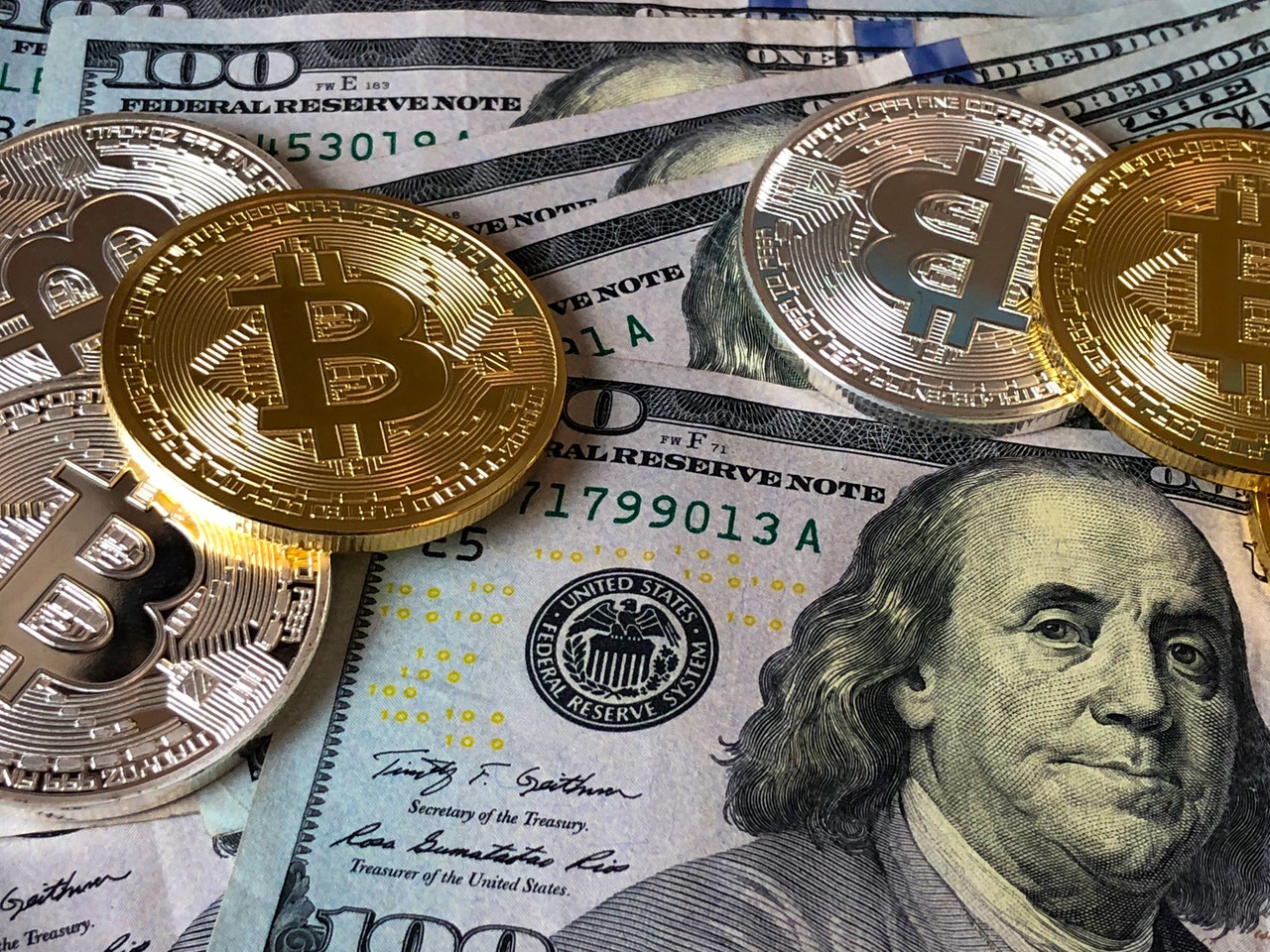 Bitcoins and US dollar bills