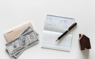 money passbook and pen in a white background